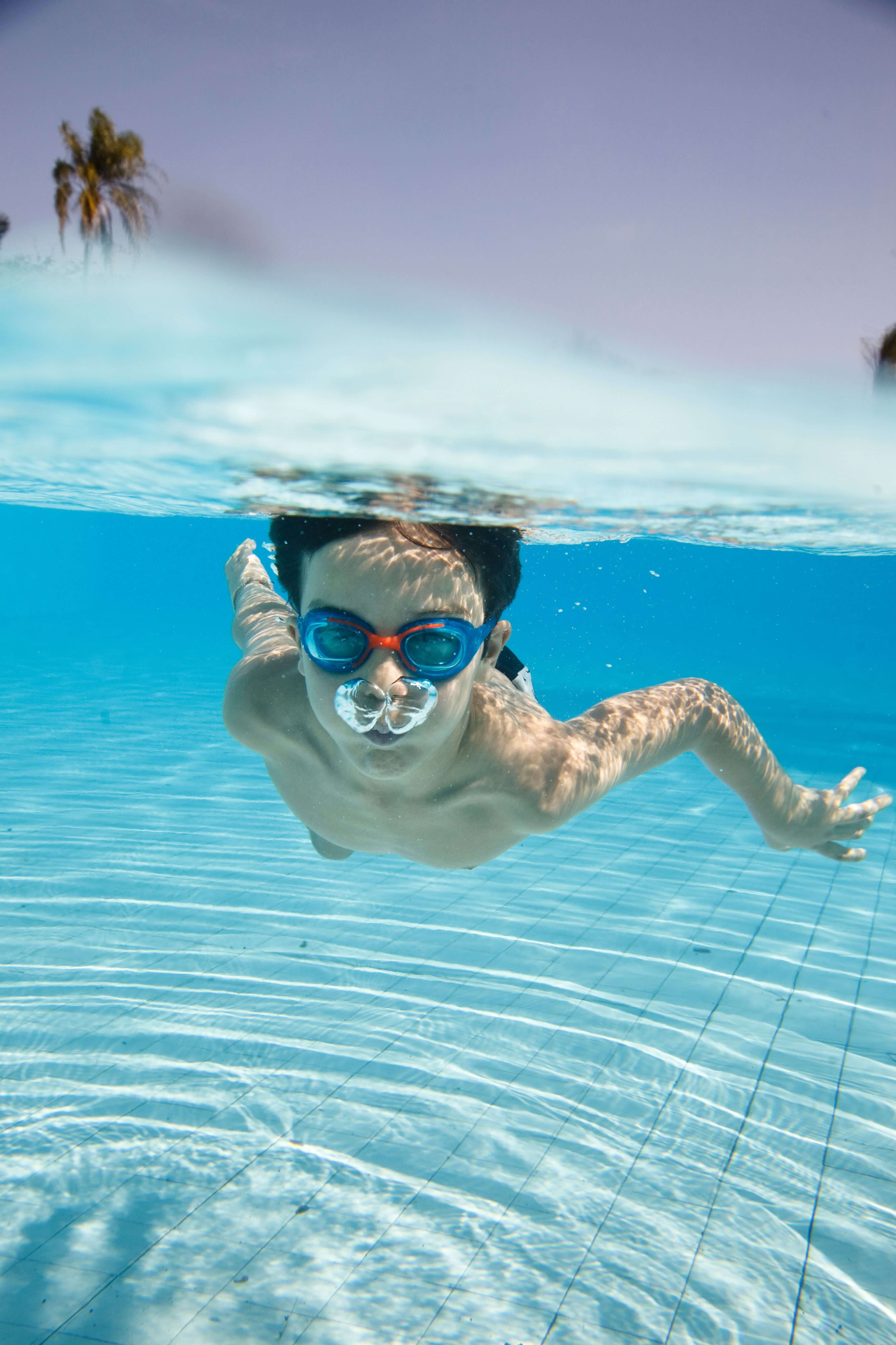 A child swimming under water