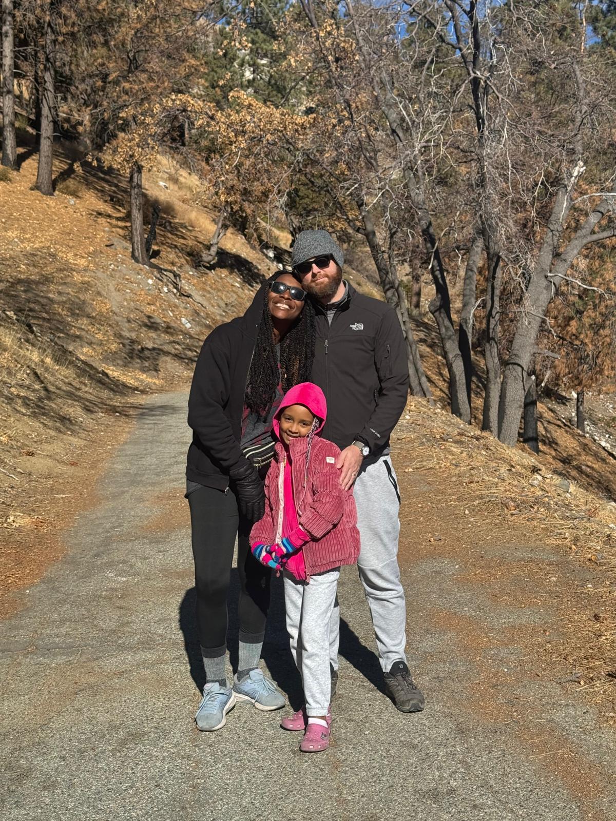 A family hug on a trail