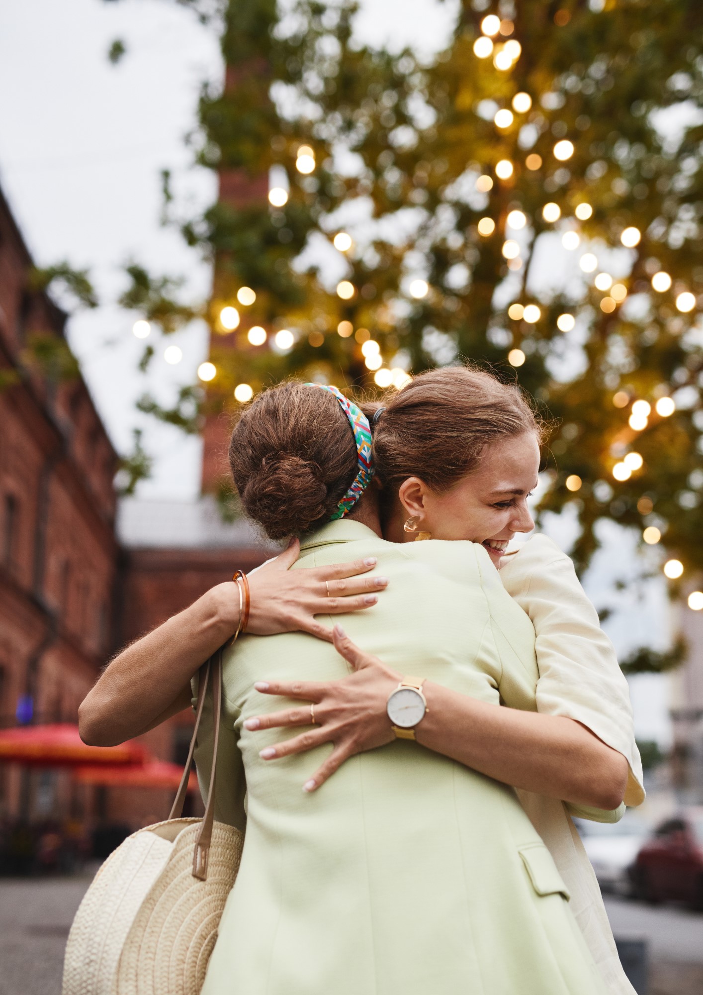 Two women hug