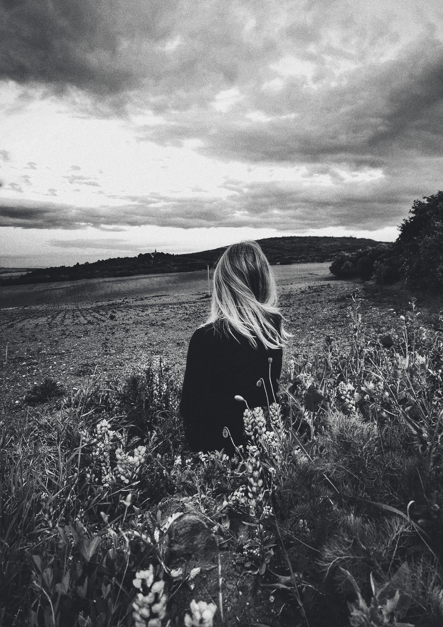 A lady stands in a field