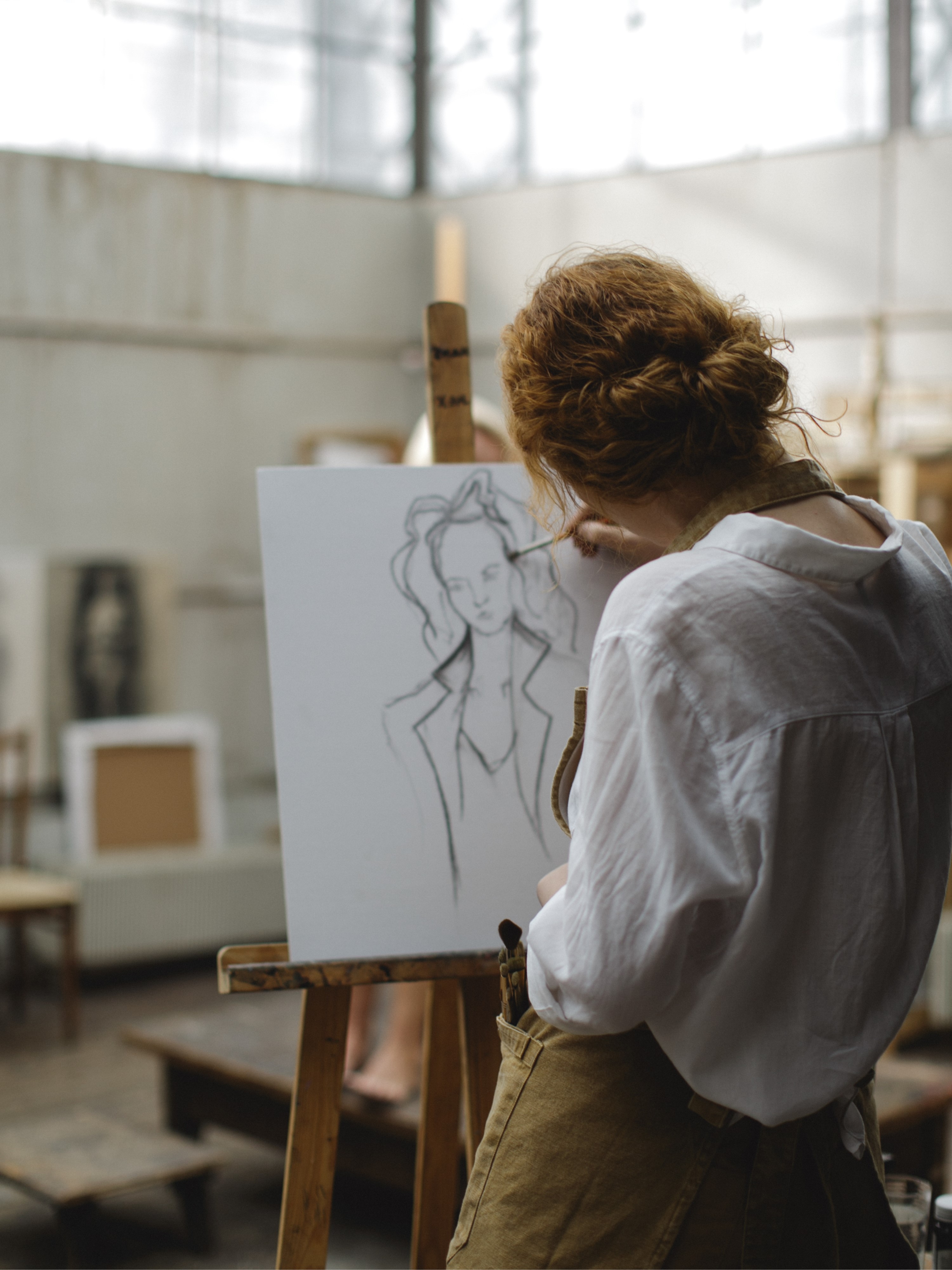 An artist paints a picture.