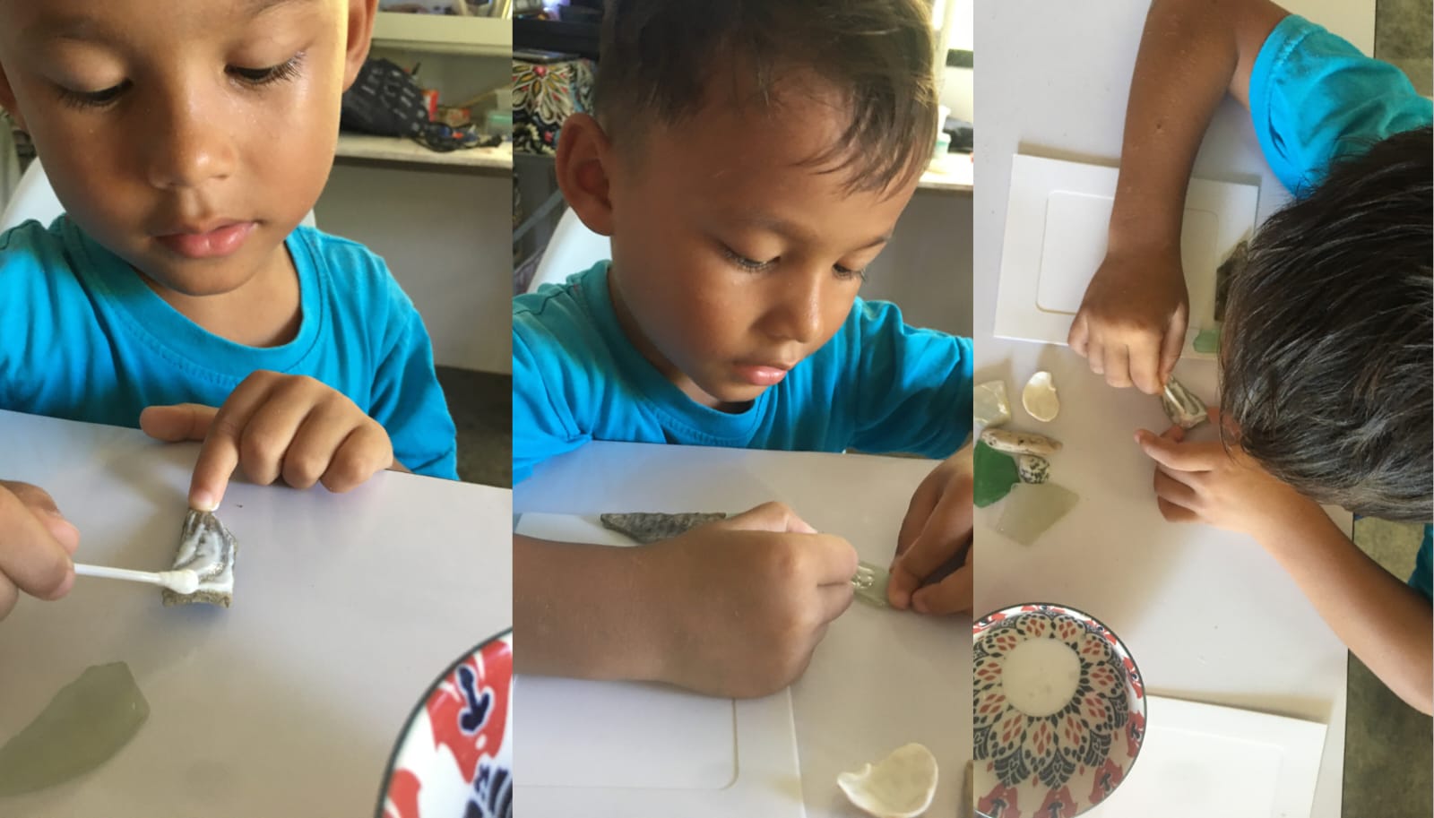 A young Thai boy crafting with glue and natural materials