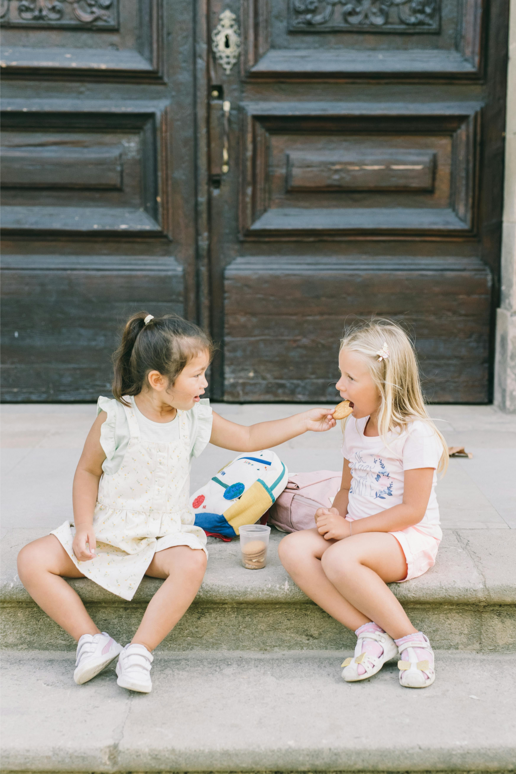 Two girl sit on a step