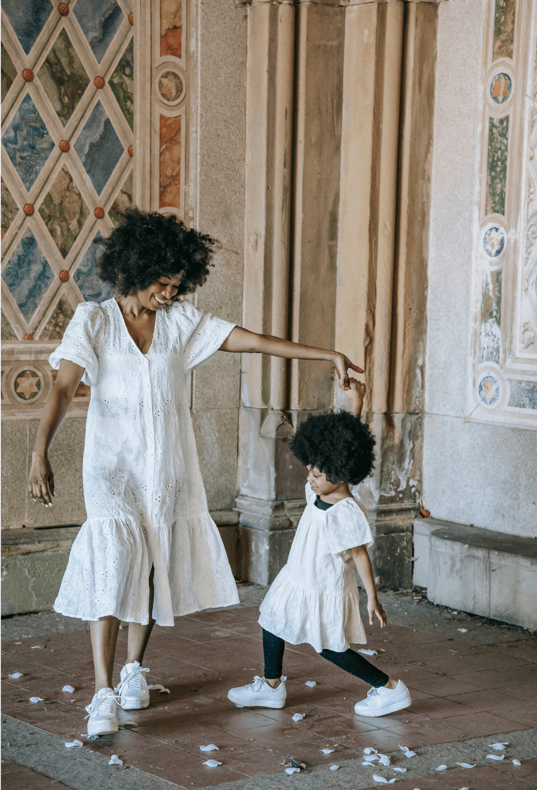 A mum and child dance together