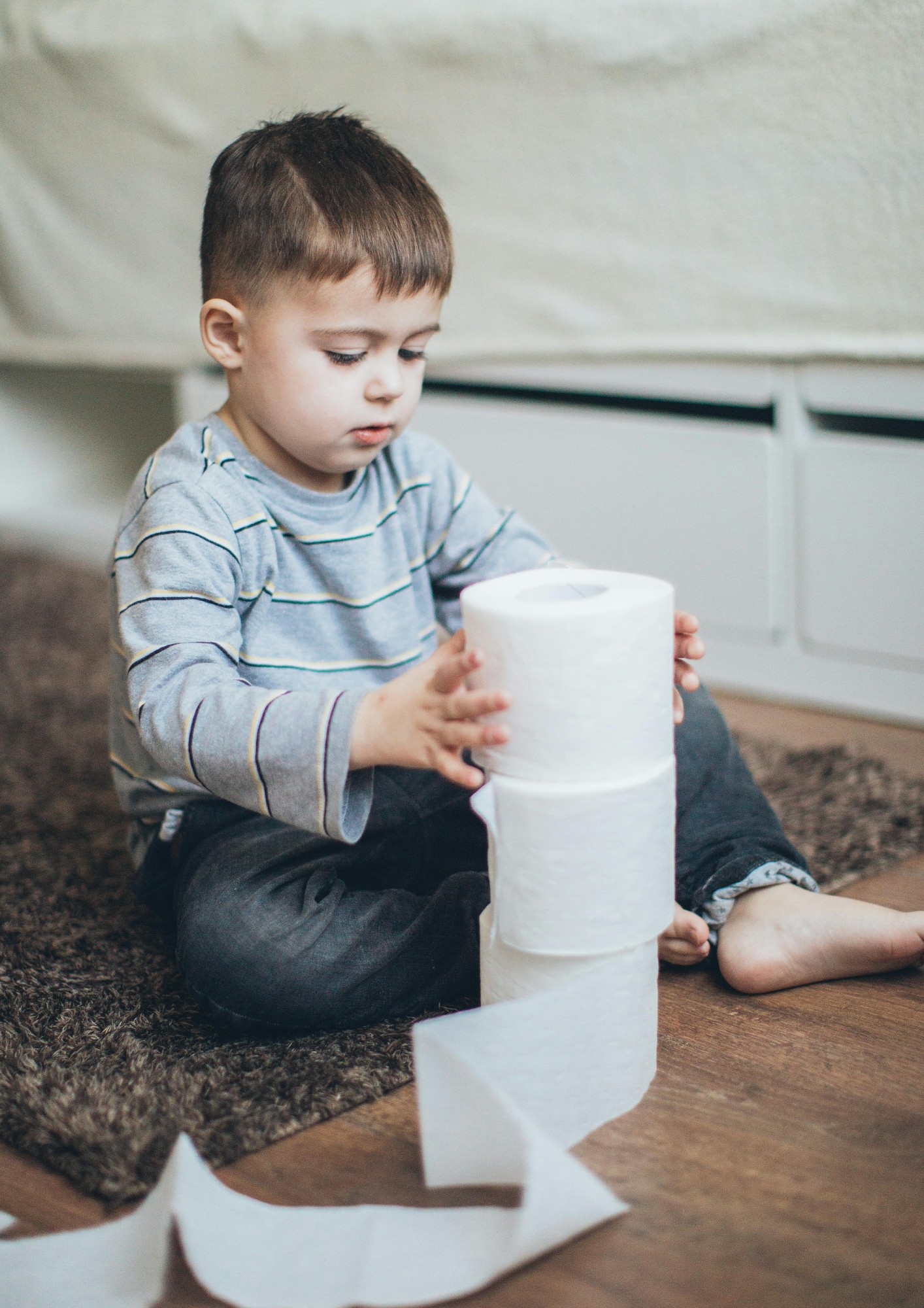 A boy with toilet paper