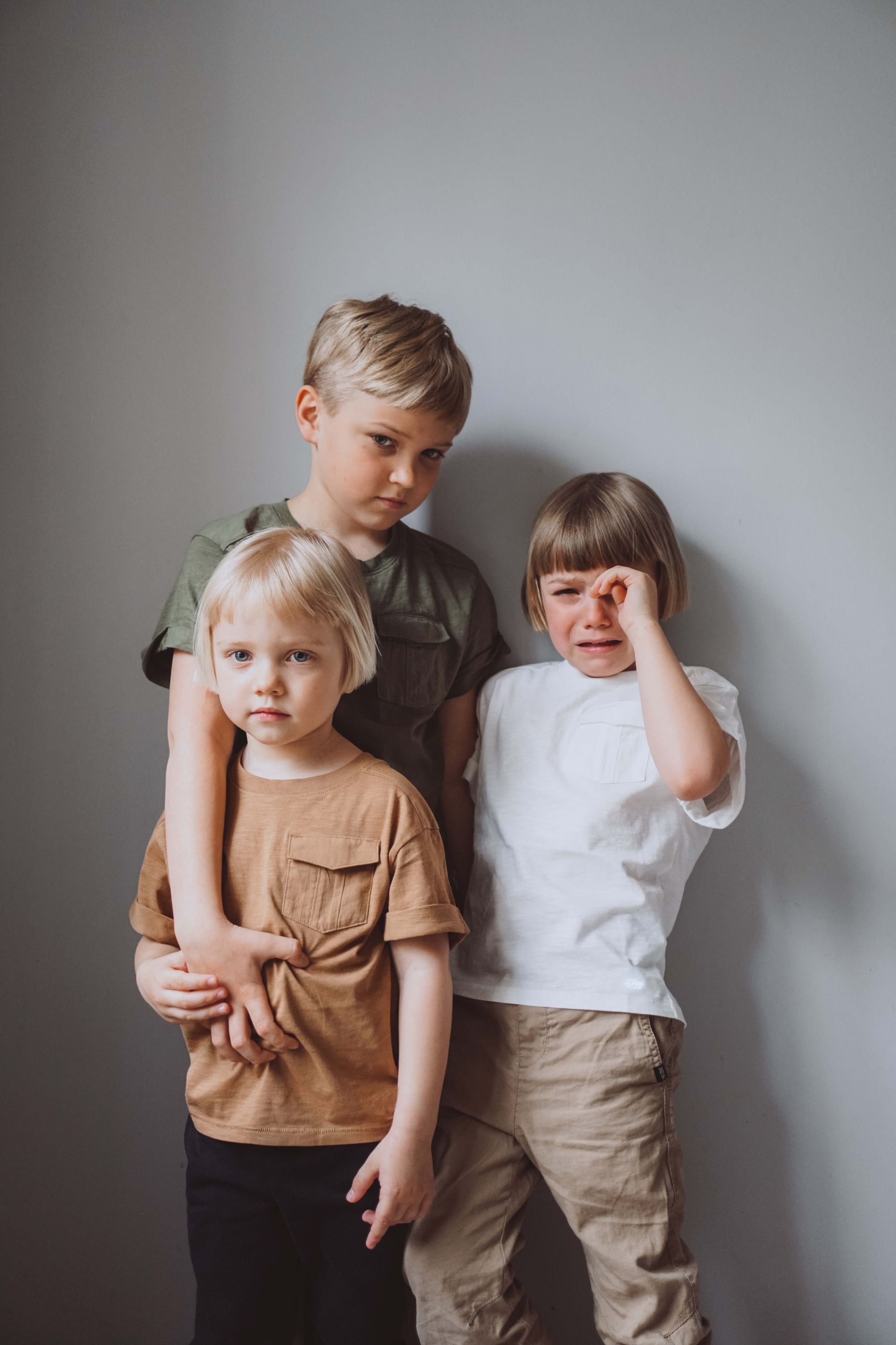 Three siblings together and upset