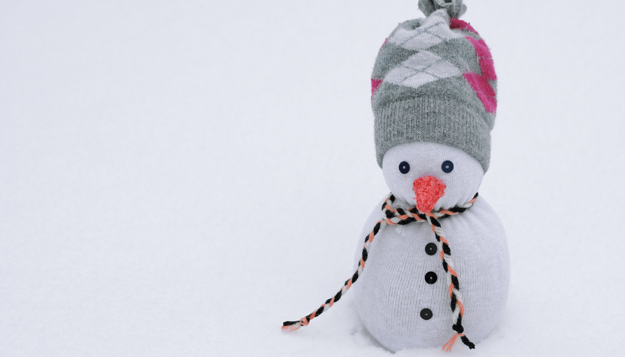 A cute handcrafted snowman made from a sock.