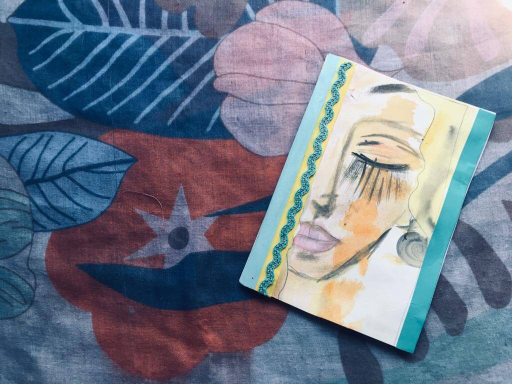 A hand-bound book with a watercolor cover