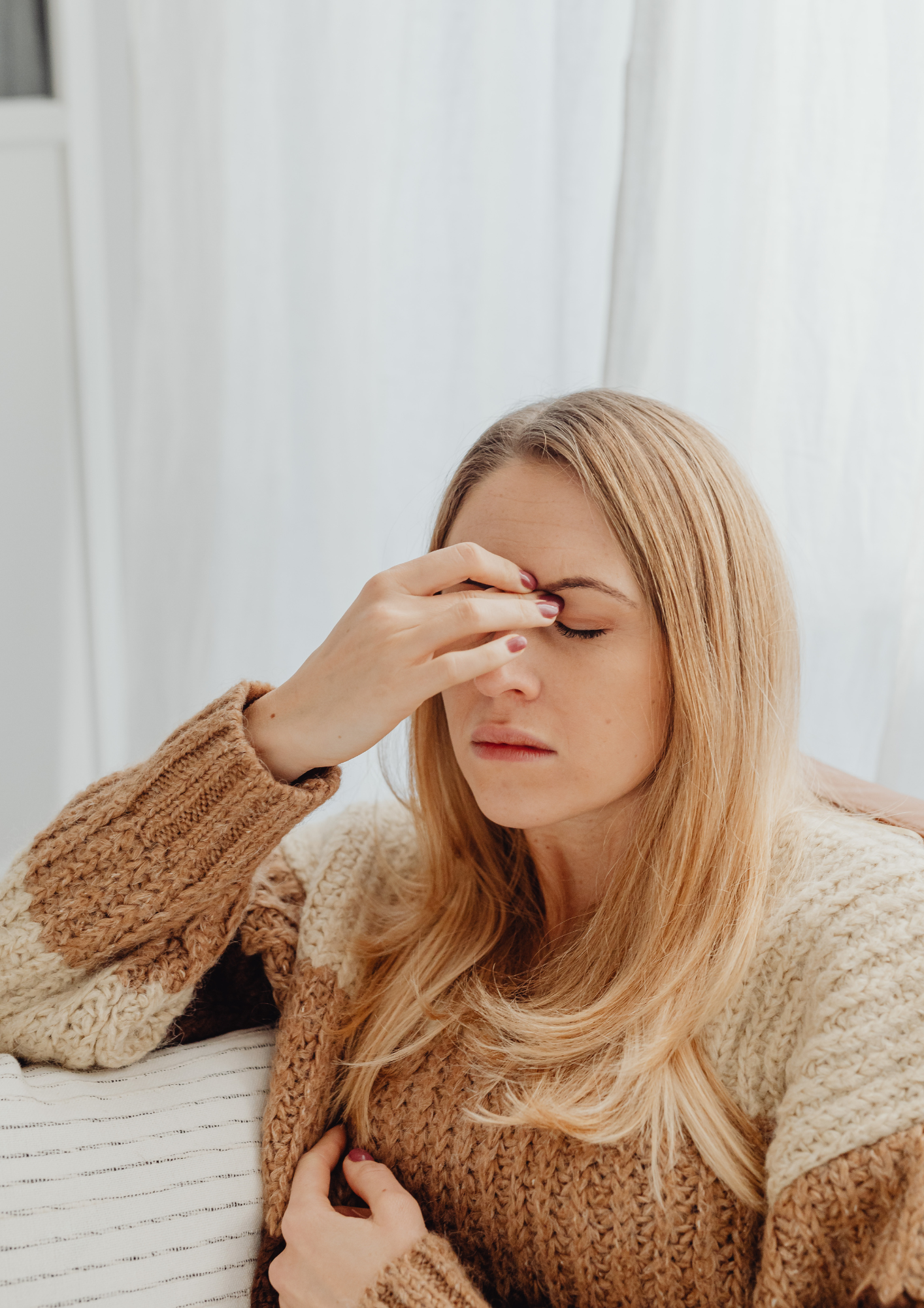 A White woman with a bad headache