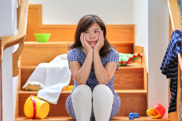A child sits on the stairs
