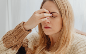 A White woman with a bad headache