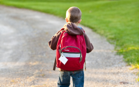 A boy with a backpack on his way to school