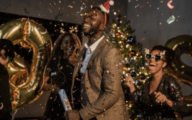 A man and woman dance at a Christmas party