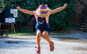 A girl jumps into the air.