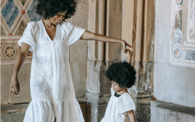 A mum and child dance together