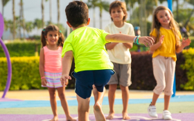 Children play hopscotch in the sun