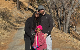 A family hug on a trail