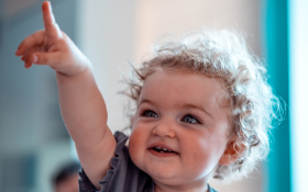 A toddler points