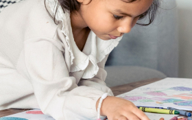 A girl colors