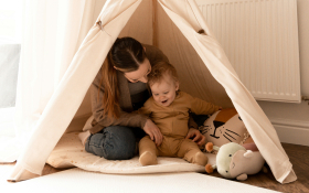 A mother and daughter in a tent